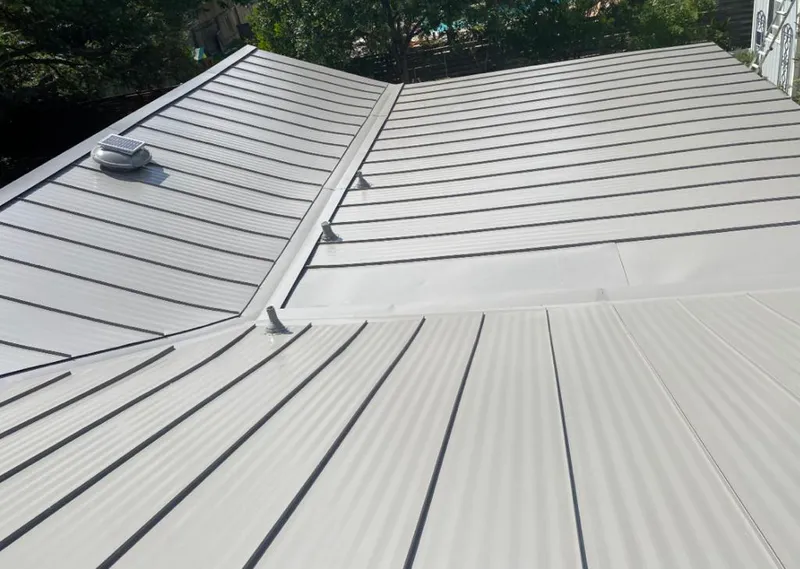 Solar attic fan installed on a metal roof for Roof Ventilation in Yorba Linda